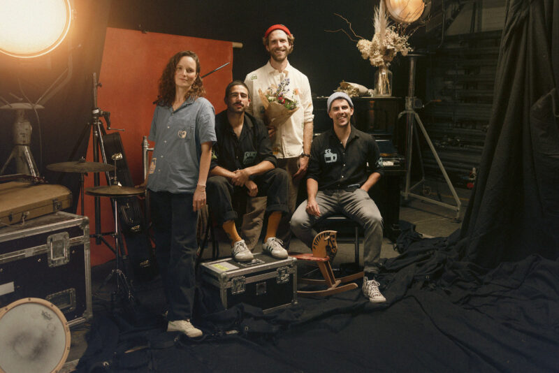 On this picture you see Max Berend and his band from left to rigth: Bettina Hummler, Alan Tucci, Max Berend and Andri Weber. The photo is taken in a backstage setting and gives the feeling of a circus.